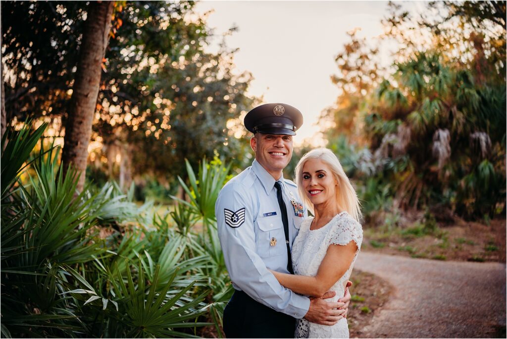Recently married couple smiling looking at camera in Philippe Park in Safety Harbor near Tampa