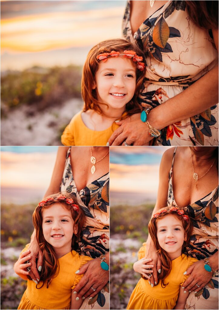 Clearwater Beach, FL Family Photography. Mother and daughter lovingly embrace at sunset on the sand dunes at Clearwater beach during golden hour full of radiant sunset colors