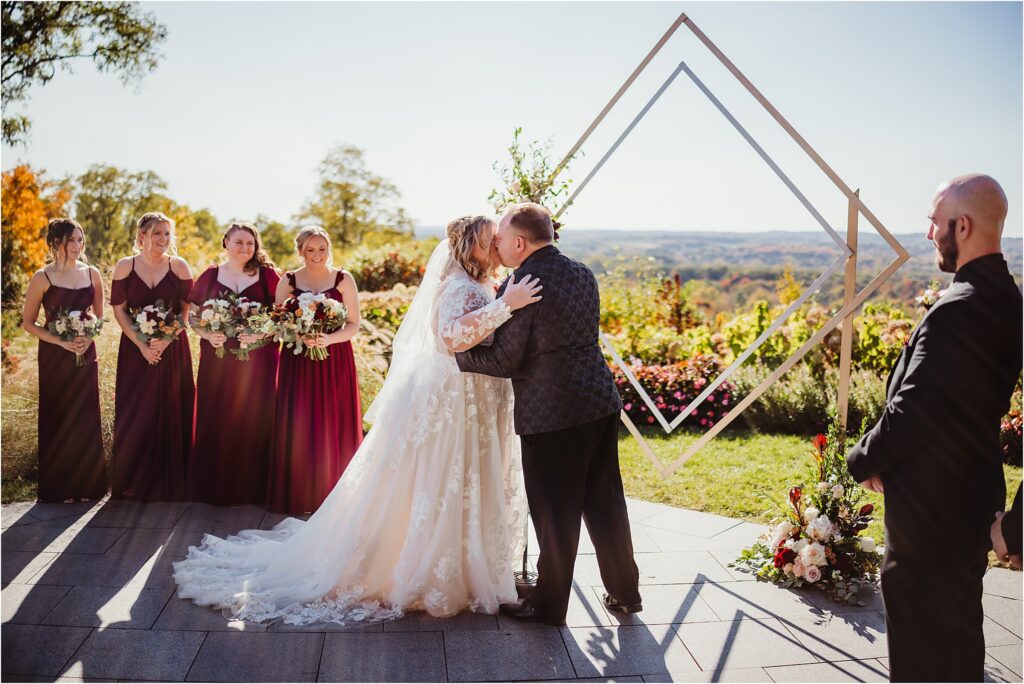 Rochester NY bridal couple embracing each other at Woodcliff Hotel & Spa during golden hour at sunset with warm florals and landscapes