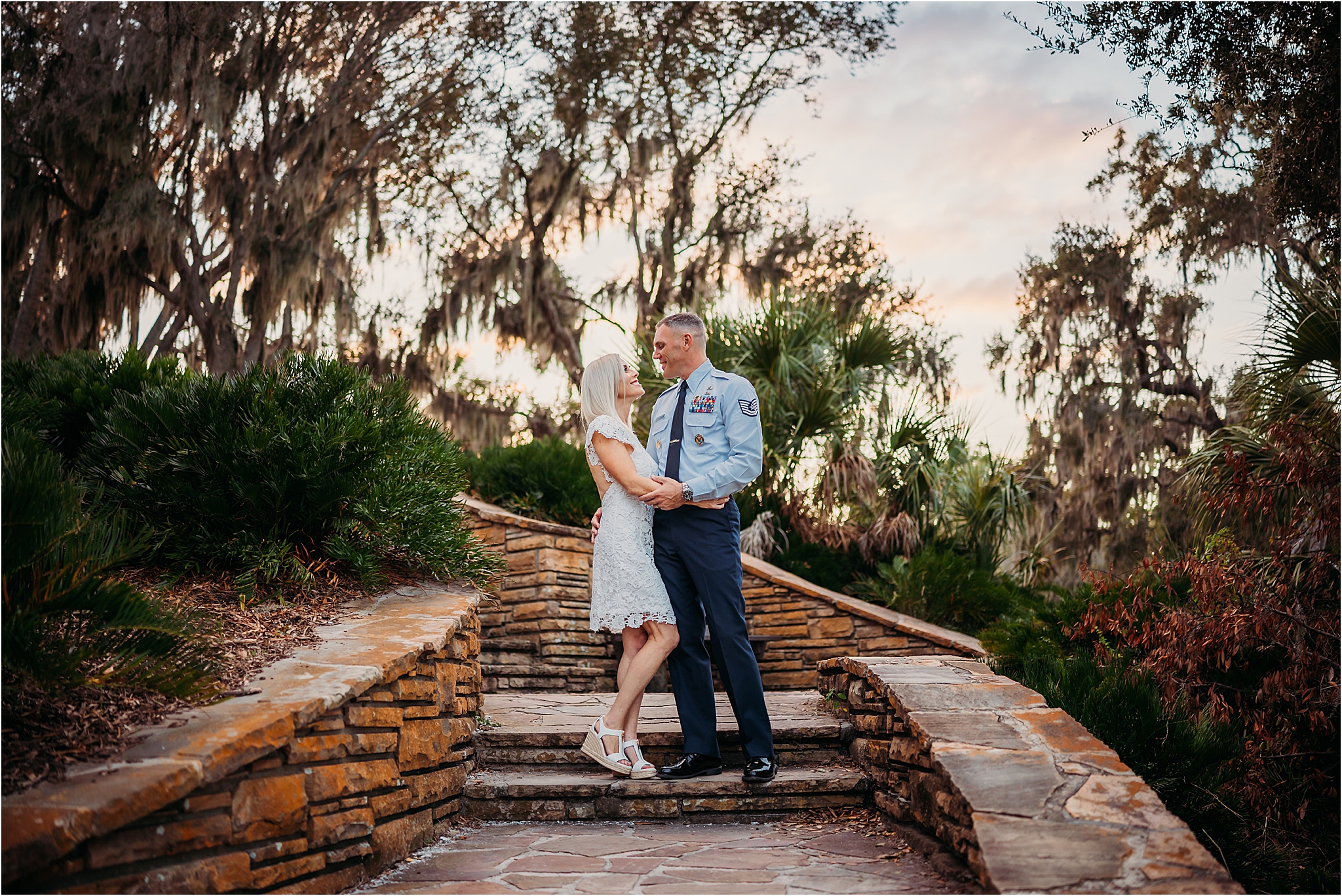 a couple's photo session on steps at Philippe Park Safety Habor near Tampa